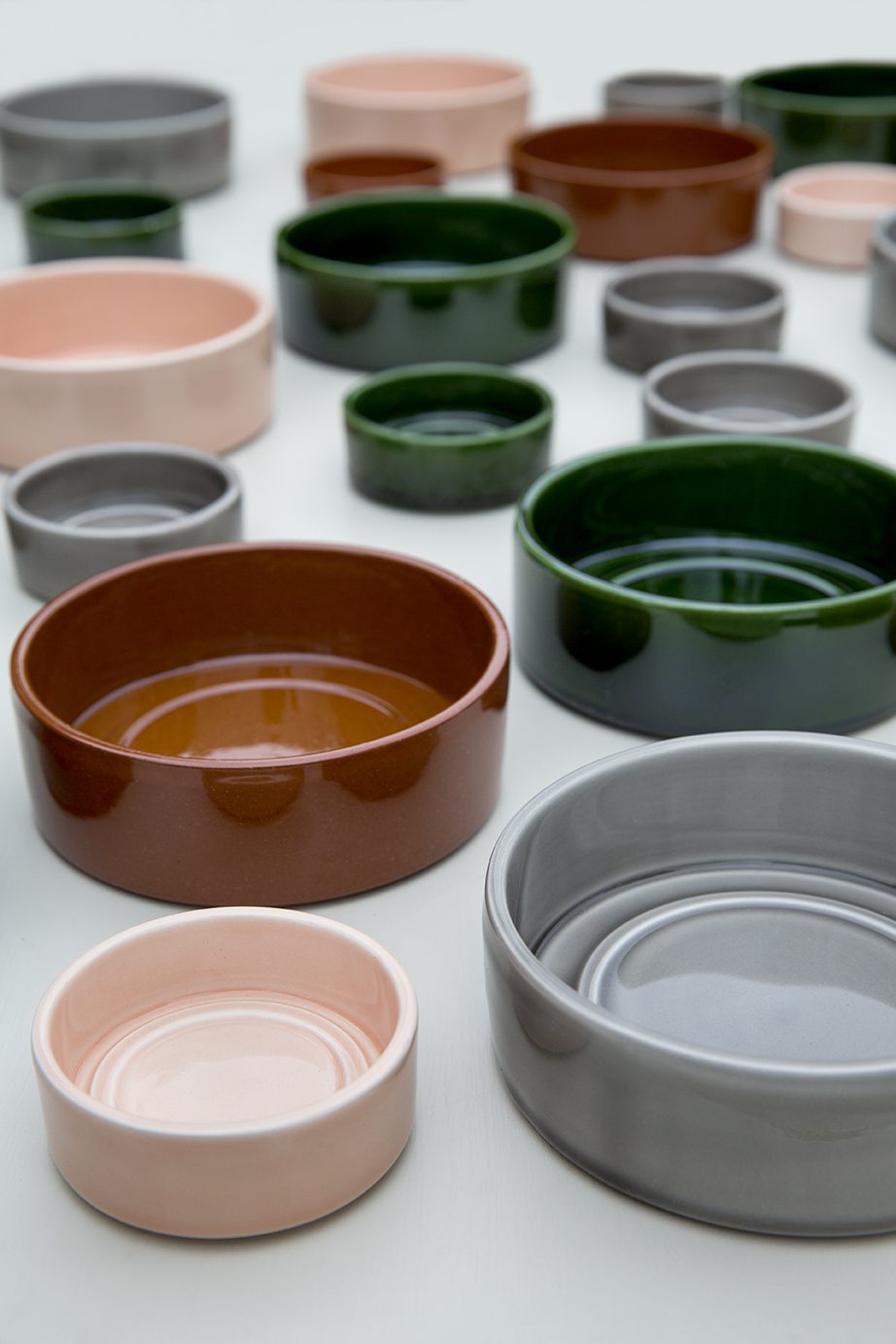 Glazed saucers in different sizes and colours.
