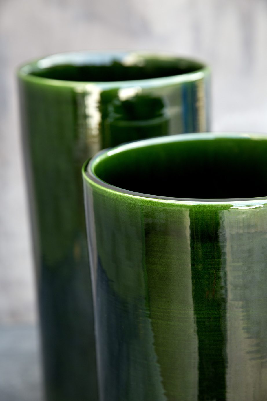 Two green glazed vases up close