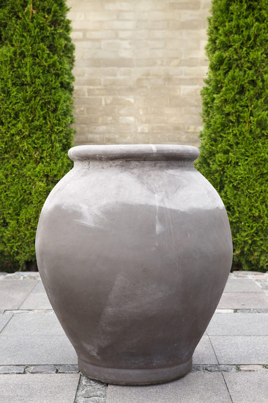 Large grey amphora-shaped outdoor pot.