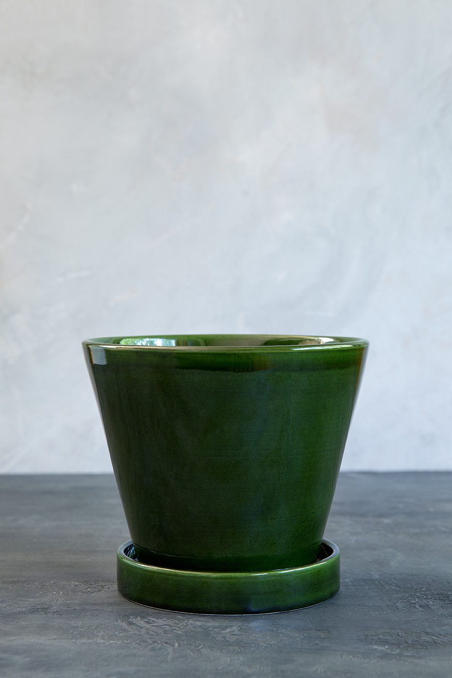 Empty glazed emerald green pot.